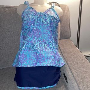Two piece blue and purple printed bathing suit accented with silver polka dots